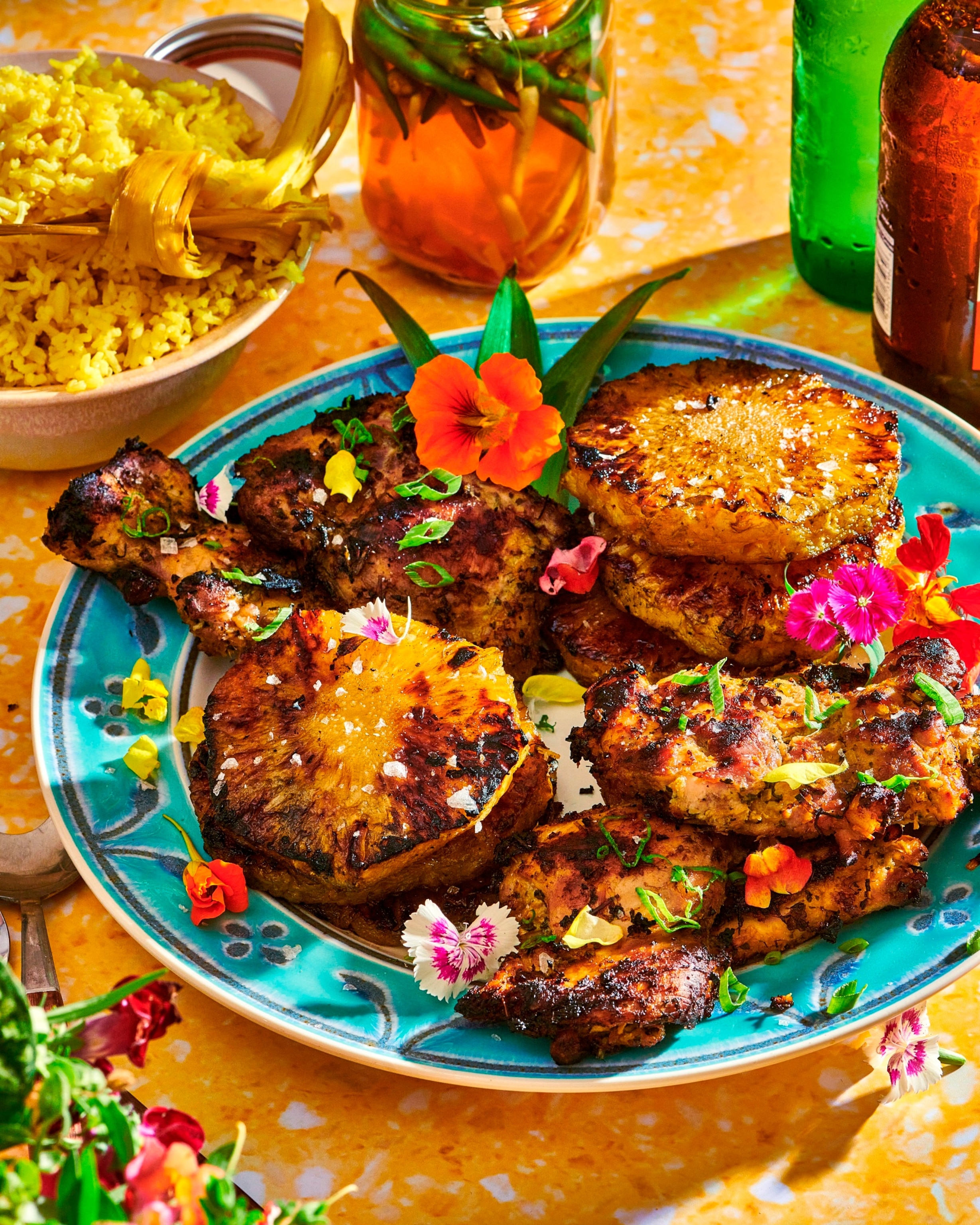 PHOTO: A plate of lemongrass adobo grilled chicken with pineapple tips.