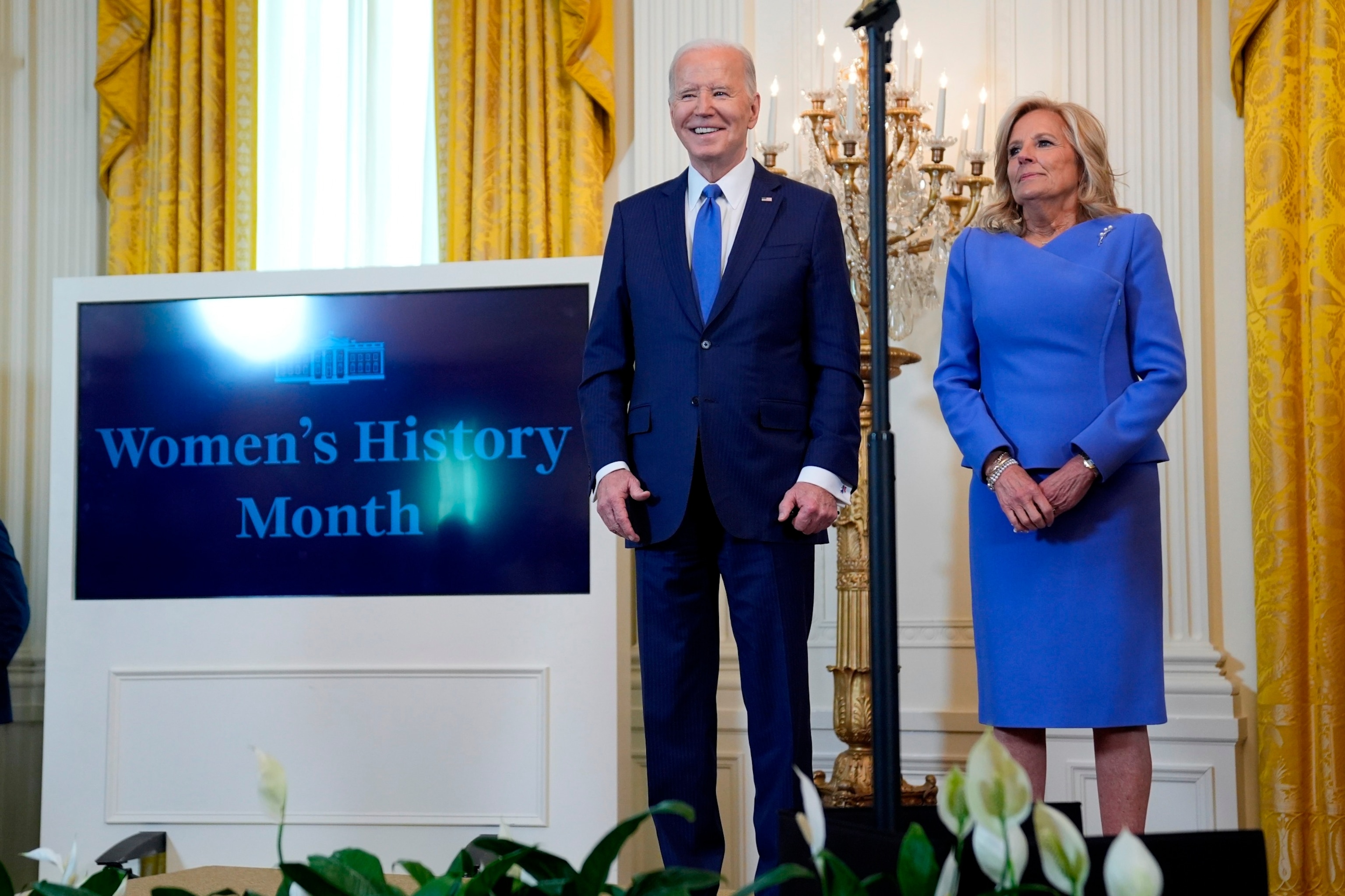 PHOTO: President Joe Biden and first lady Jill Biden, arrive for a Women's History Month event in the East Room of the White House, March 18, 2024.