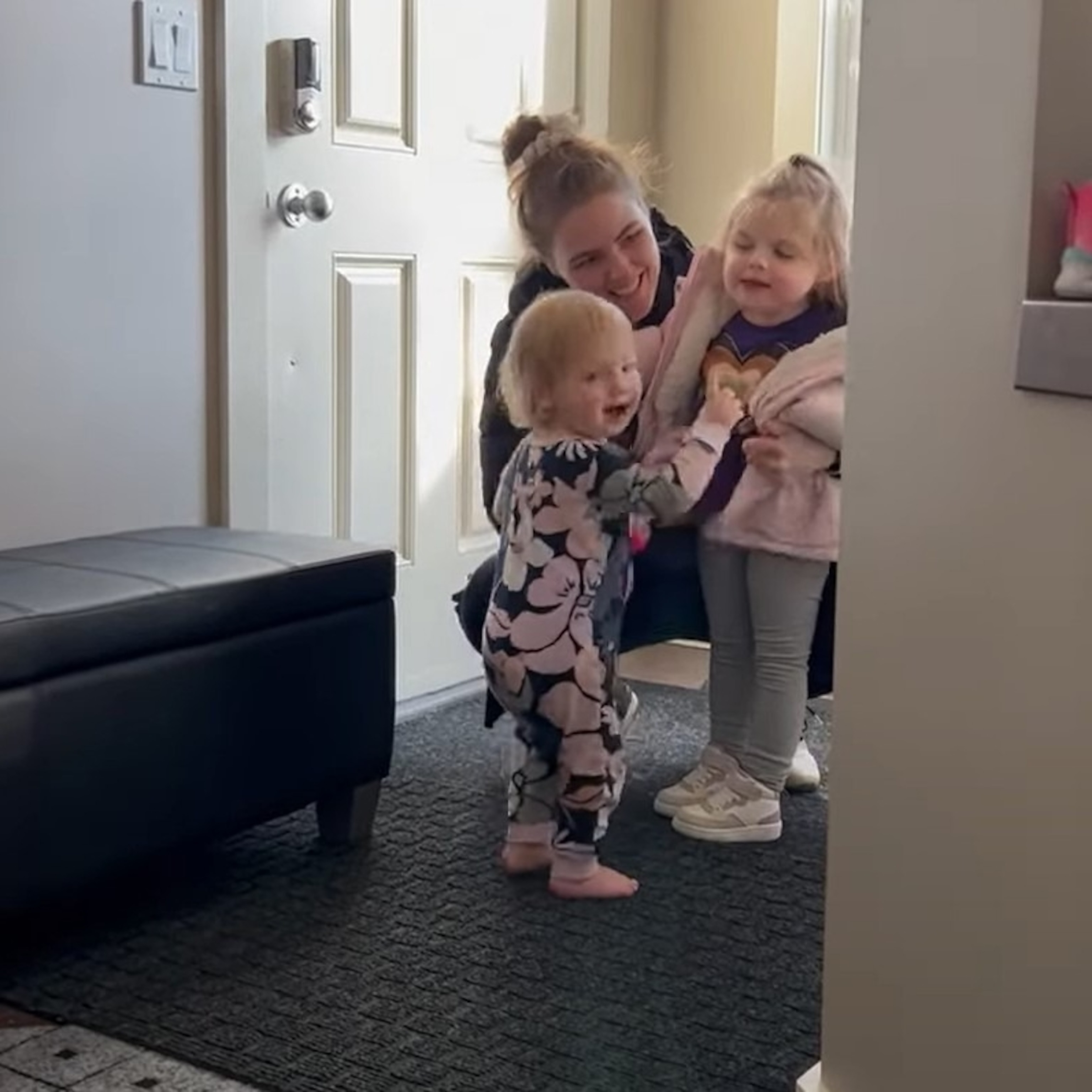 PHOTO: A toddler was thrilled when her big sister, who has a rare neurodegenerative disease, returned home after preschool in Calgary, Alberta, on Feb. 26, 2024.
